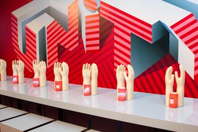 Using bold graphics and inspiring messages, Interior Design magazine’s table, titled “Together in Unity!,” aimed to inspire visitors to help those in need, with a row of hands reaching up.