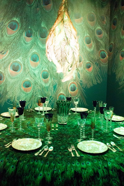 Rockwell Group’s table setting was inspired by the Peacock Room, James McNeill Whistler’s masterpiece of interior decorative art located in the Freer Gallery of Art in Washington; Whistler painted the paneled room in a rich palette of blue-green with metallic gold leaf.