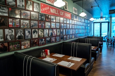 The deli, which garnered a waiting list of more than 7,000 people to dine, offered throwback prices and used proceeds as donations for the L.E.S. Girls Club; the event ended up raising more than $7,000. The inside of the deli also revamped the wall of fame to include framed images from the series.