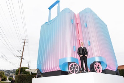 Timed with the inaugural debut of global contemporary art fair Frieze in Los Angeles, German luggage maker Rimowa showcased its newest creative collaboration—with L.A.-based artist Alex Israel—in the form of a 20-foot-tall Rimowa suitcase featuring the artist's color-graded motif (pictured here is Hector Muelas, the chief brand officer of Rimowa). The eye-catching West Hollywood activation was featured prominently in an open parking lot space at the corner of La Cienega and Melrose and was open to the public from February 14 to 16.