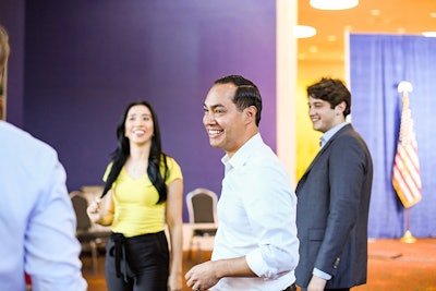 Presidential candidate Julian Castro shares a smile with staff before rally in San Antonio, TX