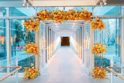 A more simple, but still sleek, take on an entrance came from the Isabella Stewart Gardner Museum in Boston's Nasturtium Patron Party. The 1970s-theme benefit, which took place in April, featured bright orange nasturtiums designed by Bloom Couture Floral Studio.