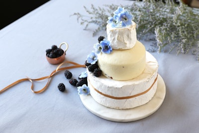 Those looking for a savory alternative to a sweet wedding cake can find options at Murray's Cheese. The New York-based cheese and specialty food company offers towers including the Truffle Deluxe Tower, which consists of full wheels of Cypress Grove Truffle Tremor, Murray’s Pecorino Tartufello, and Champlain Valley Organic Triple Cream.