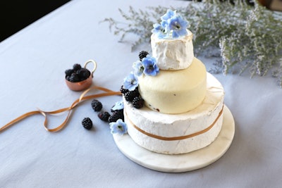 Those looking for a savory alternative to a sweet wedding cake can find options at Murray's Cheese. The New York-based cheese and specialty food company offers towers including the Truffle Deluxe Tower, which consists of full wheels of Cypress Grove Truffle Tremor, Murray’s Pecorino Tartufello, and Champlain Valley Organic Triple Cream.