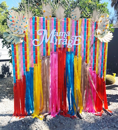 Networking group Fashion Mamas hosted its third family-friendly Coachella event, dubbed Mama Mirage, at a private estate in Palm Desert on April 13. A custom photo backdrop from artist Corrie in Color incorporated palm fronds woven into a series of colorful ribbons.