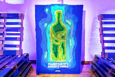 Another installation promoting the campaign depicted the Absolut bottle as land surrounded by water. The wall was created entirely with recycled straws.