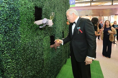 The California Science Center's annual Discovery Ball in March had an upscale take on a dog theme. In a fun twist on a champagne wall, servers wearing sock puppets offered glasses to guests from behind green hedging at the event's entrance. See more: See a Black-Tie Take on a Dog Theme