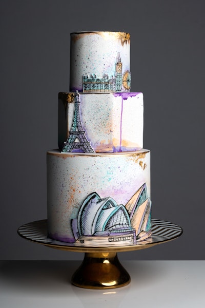 Miami-based bakery Dbakers Sweet Studio offers a variety of elegant wedding cakes. Its styles include the Travel Cake, which features double espresso buttercream and white fondant with watercolor splashes and gold, with hand-painted decorations.