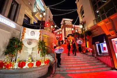 In February, Beverly Hills philanthropists Christine and Gabriel Chiu worked with Aliana Events to host a vibrant, design-heavy event to celebrate Chinese New Year. As guests climbed the stairs to the event, they were greeted with champagne and lychee cocktails. At the top was a re-creation of the entrance to Chinatown in Los Angeles, branded with the Chiu name. See more: This Lavish Chinese New Year Party Was Packed With Decor and Floral Inspiration