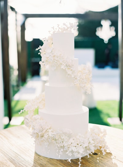 Sweet Cheeks Baking Co. also created a cake with a halo of hundreds of small sugar flowers, designed to appear as if they were floating. The flavor was vanilla bean with chocolate whip and strawberry cream.