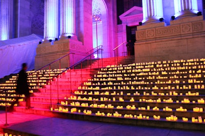 For the Phantom of the Opera's 25th-anniversary celebration, held in New York in 2013, a post-performance event brought 1,250 guests to the New York Public Library. To make a strong statement as guests pulled up, the planning team from Serino/Coyne projected a strip of red light over the library's front steps, effectively creating a virtual red carpet that led to the entrance. Hundreds of LED candles sat on either side of the illuminated pathway. See more: Phantom of the Opera Hosts Eerie Masquerade Ball for 25th Anniversary