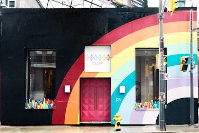 A massive rainbow welcomes passersby to the Colour Club, located at 128 Peter Street in Toronto.