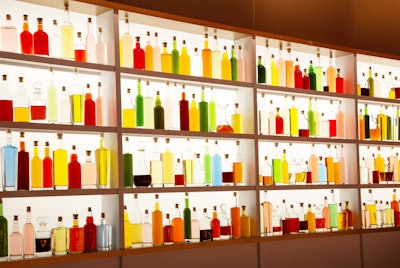 'Lately, we've gotten tons of requests for 'statement bars' that become a room’s focal point. Case in point, this example of a recent bar we created at Spring Studios in New York. It houses a grand, backlit wall niche whose shelves are lined with hundreds of illuminated bottles of vibrant liquids. Guests marveled at the illusion, thinking that the display was a glowing, flat image. Upon getting closer to it, they realized it was actually an entirely three-dimensional installation.' —David Stark, chief creative officer, David Stark Design & Production, New York