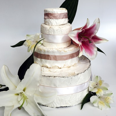 The seven-pound Celebration in Bloom Tower from Murray’s consists of full wheels of Cypress Grove Humboldt Fog, Brillat Savarin, Kunik, and Champlain Valley Organic Triple Cream. Rind cheeses give the illusion of frosting.