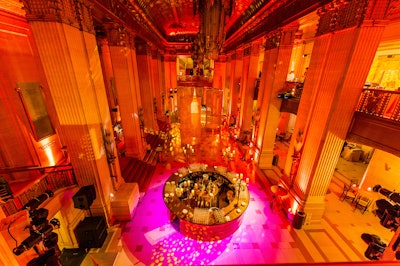 Labeled 'UNcorked,' the main level of the Lyric Opera offered dining areas, a dance floor, and circular bars from HMR Designs, decked with ornate candelabras. The names of the various event spaces played off the event's official name: UNgala.