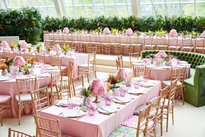 Àvila went with natural wood ballroom chairs that featured cushions covered with six different flamingo-printed patterns. The centerpieces contained tropical plants including a variety of ginger species.