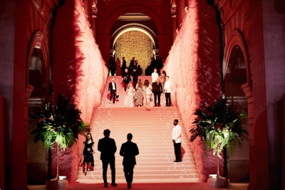 Carpeting with feather-printed borders transitioned from a pale pink at the bottom of the steps to hot pink at the top of the Grand Staircase. Oversized pink faux feathers covered the walls, creating the illusion of wings.