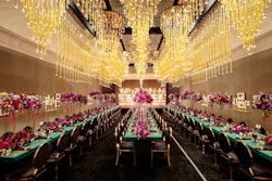 Above the dinner tables were 40 golden chandeliers from Revelry Event Designers' Moscow Collection.