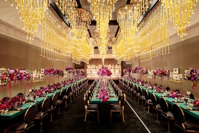 Above the dinner tables were 40 golden chandeliers from Revelry Event Designers' Moscow Collection.