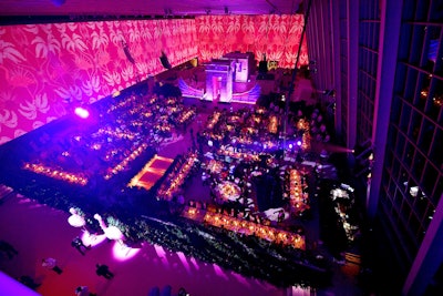 Massive pink curtains featuring flamingos surrounded the dining space, which was awash in a pink glow.