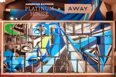 To coincide with London Fashion Week in September 2018, the American Express Platinum House was produced and designed by Momentum Worldwide. Graffiti artist Jay Caes created a Brick Lane-inspired mural on a wall made of Away suitcases. Throughout the weekend, guests received complimentary luggage stickers and could shop select items from the luggage brand's 'travel uniform' program.