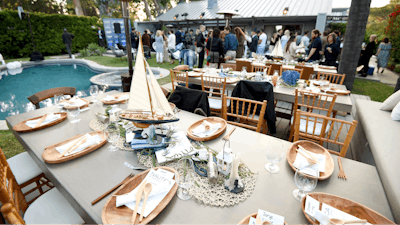 Apparel brand Nautica teamed up with actress Brooke Burke to host a benefit dinner for the Nautica Malibu Triathalon and Children’s Hospital Los Angeles. Held in Malibu in late April, the summery event had centerpieces with sailboats and other appropriately nautical props from Host Boutique Events, plus a catered dinner from plant-based chef Tal Ronnen.