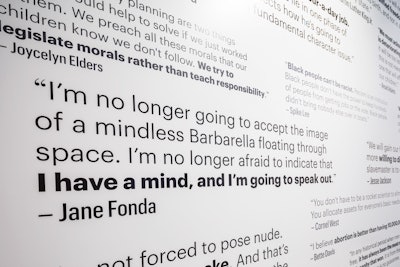One room features walls covered in quotes from famous figures such as Jane Fonda, John Lennon, Stephen Hawking, and Cher.