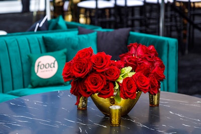 Food Network-branded pillows topped the couches, and florals in bright colors were designed by L.A. Premier.