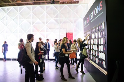 For unresolved questions at the Barometer lab, guests could write down thoughts and additional questions on an adjacent wall.