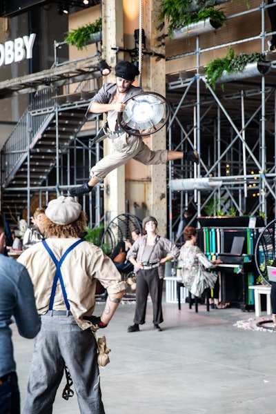 Montréal is known as a city of arts and creativity, and this was exemplified with a group of roving acrobats that “inhabited” the three-day conference. Performance troupe the Spirits appeared from the ceiling throughout the event, dressed in 19th-century industrial attire that paid homage to Grandé Studios’ history. The venue is located on the grounds of the former Grand Trunk Railway yards and shops, which opened in the mid-1850s and was once home to the largest train repair shop in Canada.