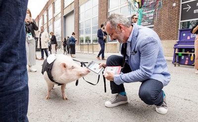 One of the high-profile conference attendees was Christopher the Pig, an Instagram influencer with more than 83,000 followers. The pig had his own Klik attendee badge, and here posed (and exchanged information) with C2 president Richard St-Pierre.