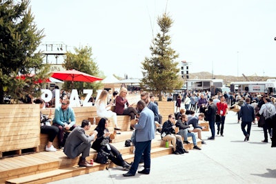 The outdoor plaza area served as a space for guests to eat, drink, and mingle. The vacation-style atmosphere offered the returning cabana bar, local food truck vendors, and a pop-up Nespresso café.