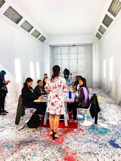 Once again, the conference provided a variety of eclectic meeting spaces for attendees, including a garage-like white conference space splattered in paint.