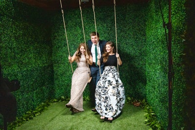 Instead of a traditional photo booth, an activation from Smilebooth let guests create short videos as they swung in front of a leafy wall.