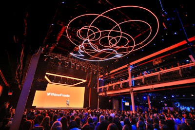 The main presentation area featured a massive, neon-lighted chandelier consisting of overlapping circles and a silhouette of the company’s bird logo. The circles were designed to mimic the energy of Twitter and the overlap of conversations on the platform.