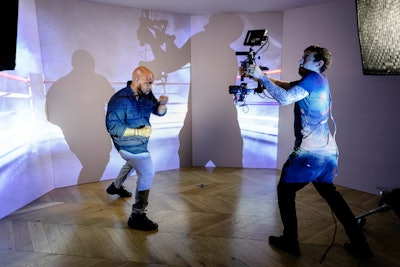 Another interactive station for guests was a video booth that invited them to show off their shadow boxing skills against the backdrop of a digital boxing ring. The end result was a black and white video with Ali’s “I am the greatest” quote appearing on the screen in gold, with the film's tune-in information as an end card. The video was edited on site and could be shared on social media.