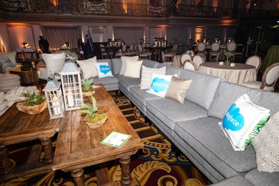 Salesforce sponsored the late-night party, and the company's branding showed up throughout. There were Salesforce pillows on the couches, and the company's logo appeared on the dance floor. Additionally, waitstaff wore Salesforce branded aprons. All major sponsors of the after-party had their own reserved lounge areas, with pillows bearing the company's name instead of 'reserved' signs.