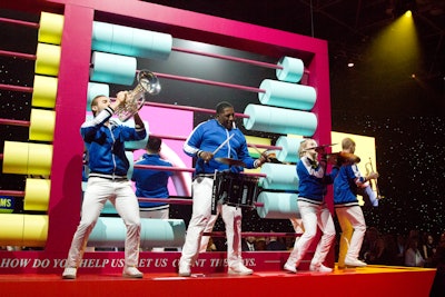 To transition to from cocktails to dinner, a marching band and dancers flooded the space for a production number featuring an original song based on a Janelle Monáe song she performed on Sesame Street.