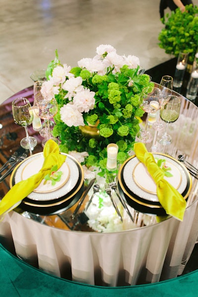 A collaboration with Three Petals Design, the elegant green and white space used rentals from MTB Event Rentals and Premiere Party Rents and linens from Luxe Linen.