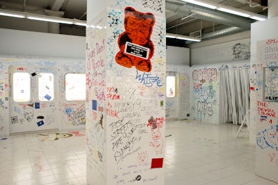 For Coach's first external brand activation, held in New York in June 2018, the brand worked with the Projects to create four interactive rooms that encouraged self-expression. One room, called 'Logo Mania,' was an all-white space inspired by a subway platform. Guests could use coins to get a bucket with paint markers, stickers, and stencils to express themselves. Read more: Coach's First External Activation Invited Guests to Explore a Cosmic-Fueled Playground