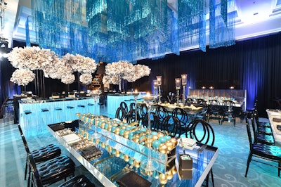 For this bat mitzvah, honoring a young lady named Madison, “I took inspiration from NYC and Madison Avenue when crafting this chic and youthful design. Swarms of tufted ‘Madison Avenue Times’ sculptures soared above tables, while white, gold, and teal apples hovered under and on top of the dining surfaces.”
