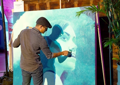 Artist Levi Ponce painted a portrait of one of the show’s main characters throughout the event.