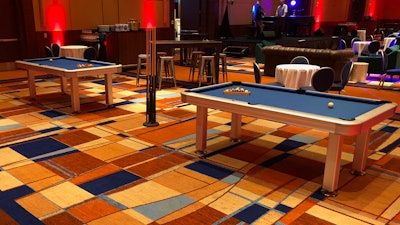 A pair of billiards tables are part of a piano lounge created by Hosts DC Destination Management Company for a corporate event at a Baltimore, MD hotel.