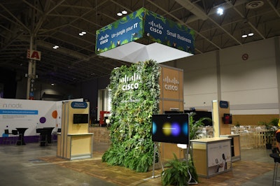 Networking hardware company Cisco showcased a living wall inspired by their tagline 'Has Your IT Gone Wild.' The wall served as a photo op for attendees. GES Canada built the booth and living wall, and the design was helmed by Cisco designer Nicole Dufraine.