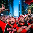Toronto Raptors fans watch Game 2 of the N.B.A. Finals in Jurassic Park, outside Scotiabank Arena in Toronto, on June 2.