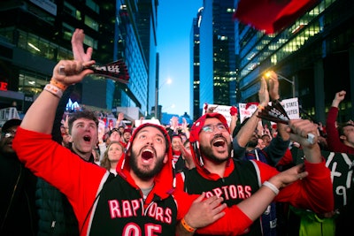 Toronto Raptors fans watch Game 2 of the N.B.A. Finals in Jurassic Park, outside Scotiabank Arena in Toronto, on June 2.