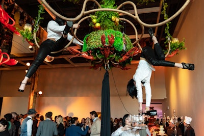 Aerialists from A Girl in the Sky productions poured glasses of prosecco while hanging from the lobster chandelier.