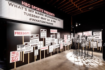 Another room at the pop-up was wrapped with graphics of Ali quotes, while a vintage TV wall played footage from the documentary. A third room, designed to highlight the boxer's activism, featured a microphone installation backed by replicas of picket signs from marches and rallies Ali had participated in. See more: HBO Took Guests to the Ring With a Muhammad Ali Pop-Up