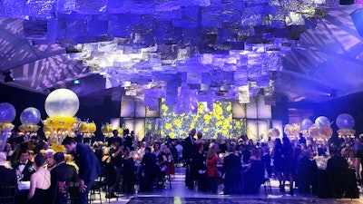 “One of the co-chairs for the [Silver Anniversary Daffodil Ball] was a big-wig from Rio Tinto, one of the big producers of aluminum foil. So my immediate instinct was to find a way to include their product in the silver anniversary. I designed a 150-foot by-20-foot ceiling structure that would feature an abstract wave of silver foil panels. A combination of L.E.D. wash lights and moving spots would bring it to life throughout the event. Hundreds of man-hours were spent cutting and crumpling foil panels and smoothing them back out in pre-production. Miles of foil were used.”