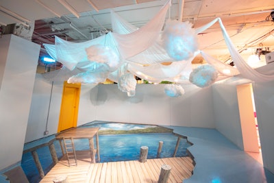 For a room inspired by wines found in upstate New York, organizers partnered with artist Nate Baranowski, who painted a 3-D floor image of a pier on a lake in New York. Experiential art agency YTG Agency built a cloud and fabric ceiling installation.